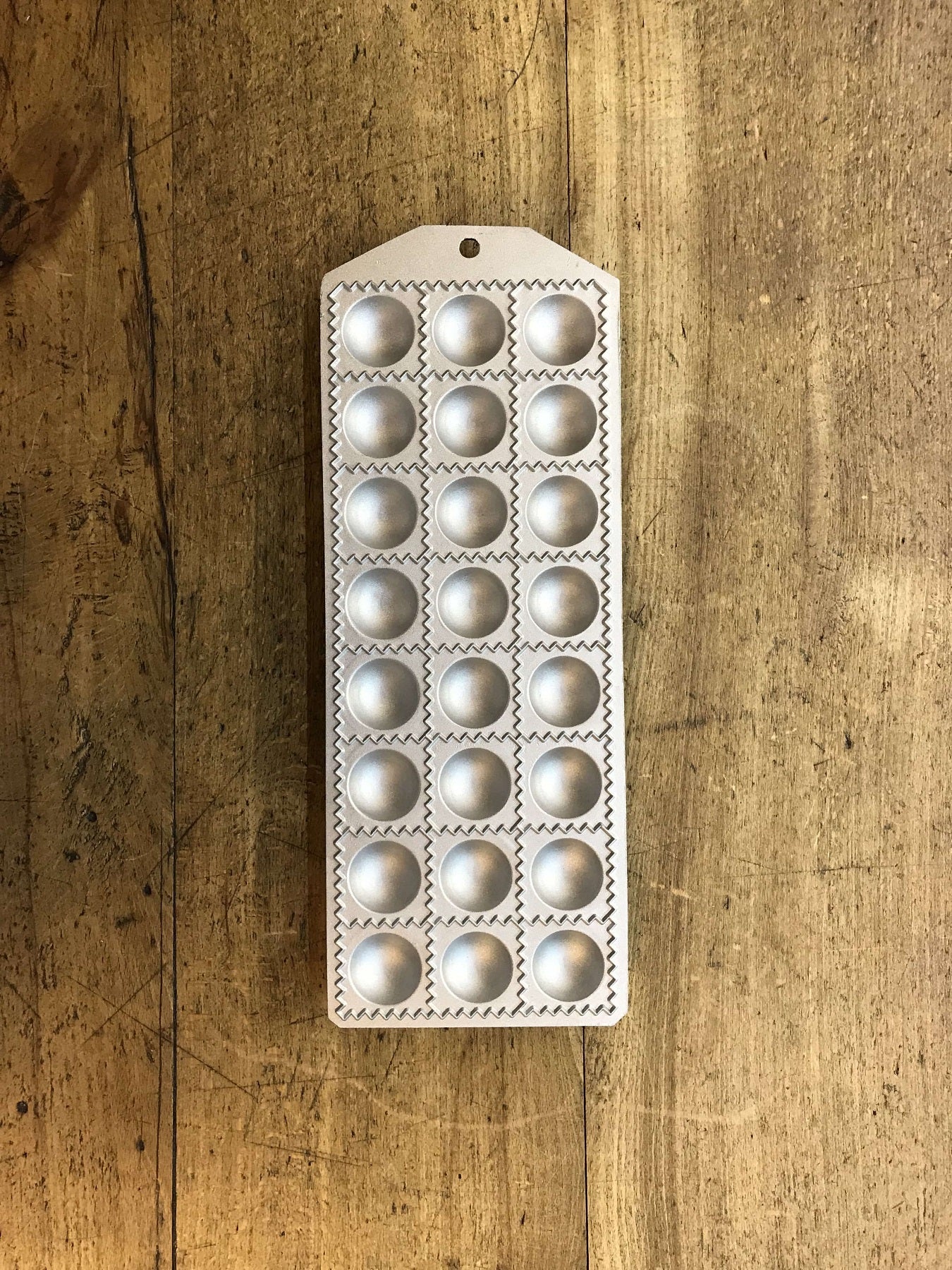 Mold for 24 square ravioli with round filling