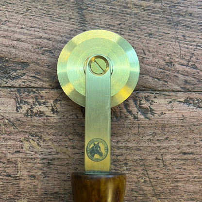 Brass spur with smooth wooden handle