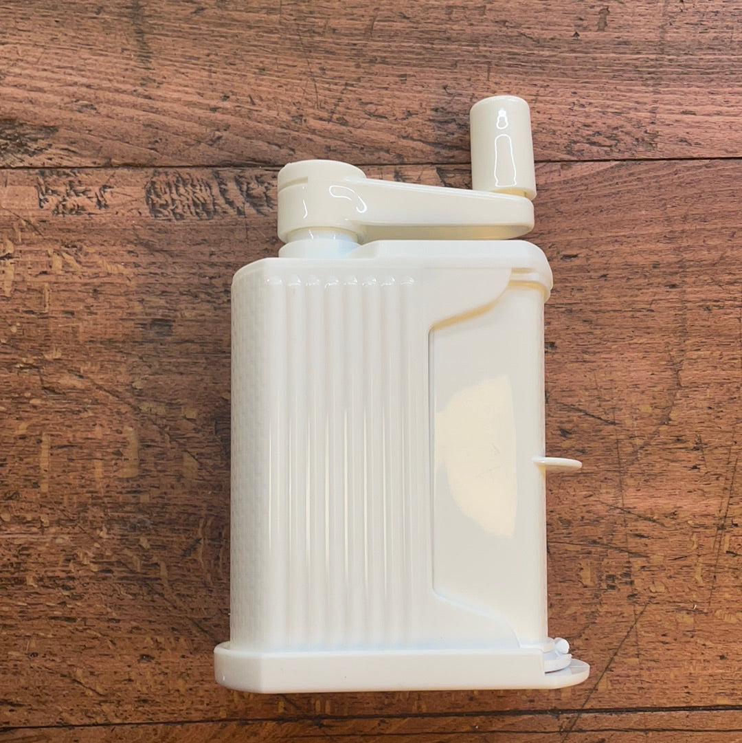 Grattuggia a manovella in plastica